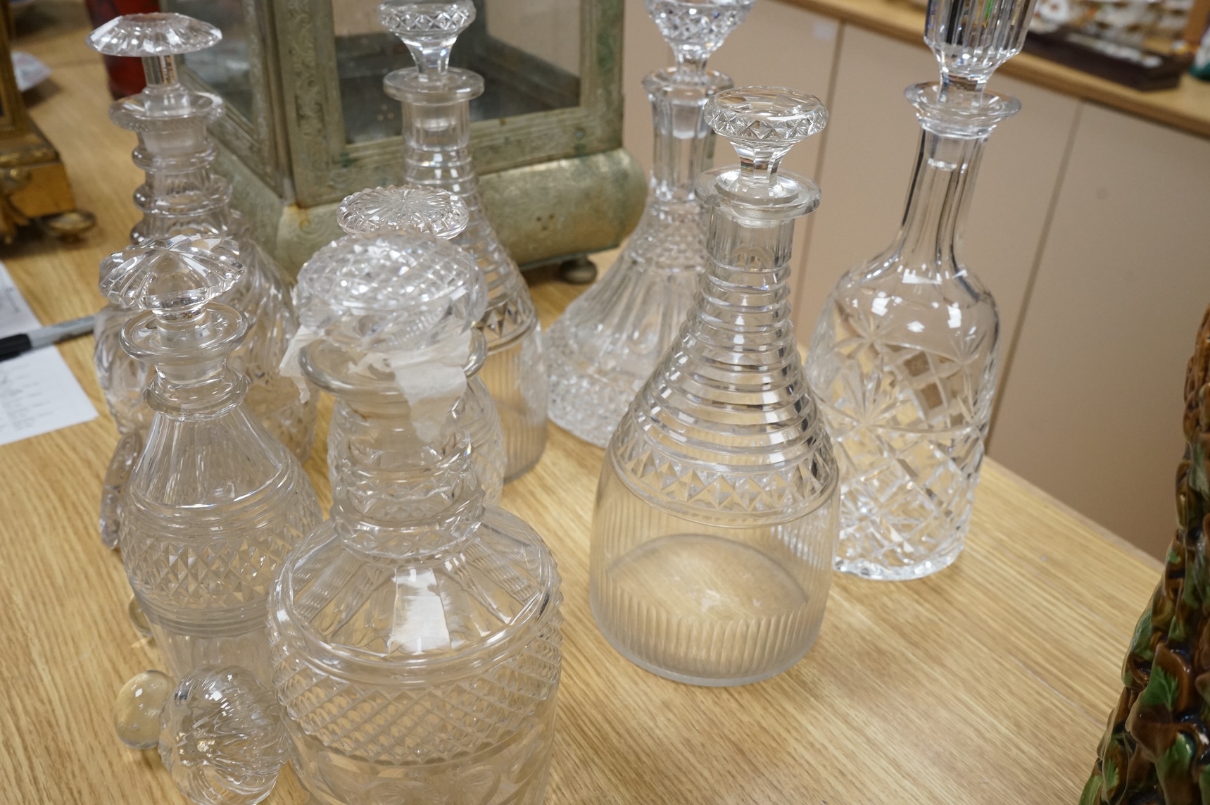 A collection of Regency and later glass decanters and stoppers, tallest 31cm